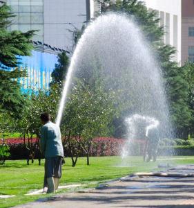 one of our Little Elm sprinkler repair pros is redirecting a commercial sprinkler